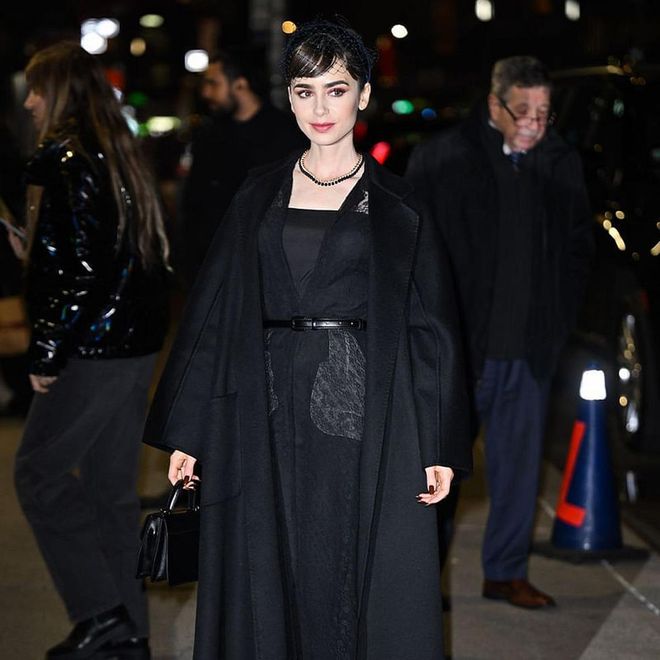 Lily Collins Channels Audrey Hepburn in a Black Cocktail Dress and Fishnet Veil