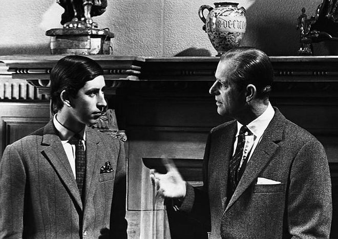 Prince Charles talking to his father, the Duke of Edinburgh, at Sandringham shortly before the ceremony marking Charles as Prince of Wales.