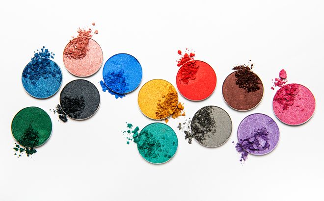 Assorted colors metallic blusher or eyeshadow on white background.