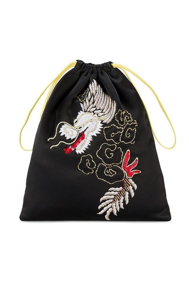 Attico's embroidered drawstring bag fuses both ornateness and sports chic. Its intricate dragon embroidery teamed with its youthful shape make it very desirable indeed.
