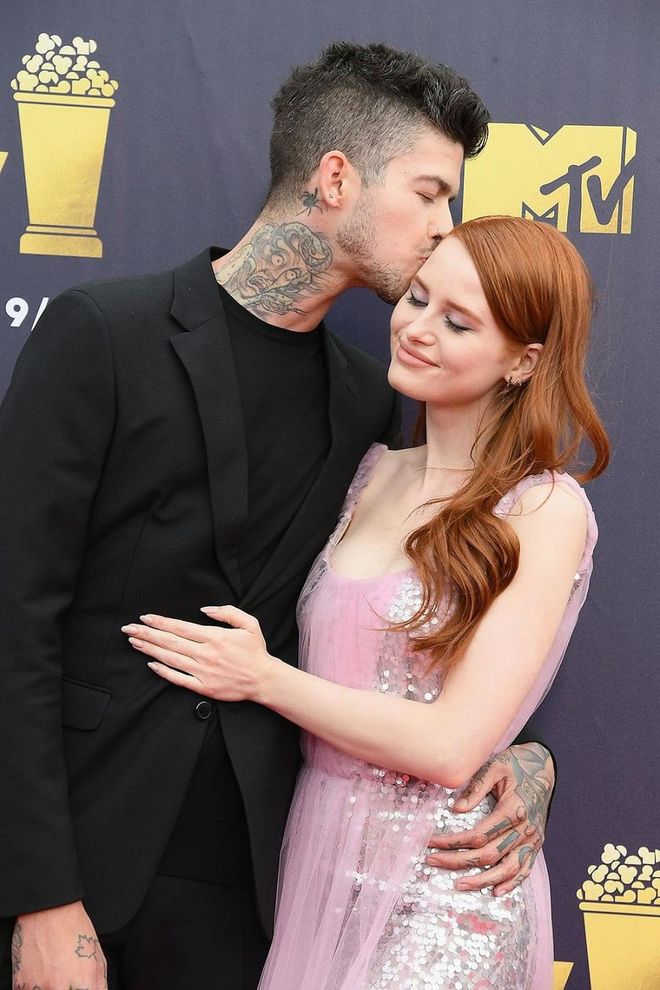 Madelaine Petsch and Travis Mills aren’t shy about their relationship (the two actively post photos of each other on social media and have been vocal about their relationship over the past year), so it doesn’t come as shock that the Riverdale actress and Mills are super adorable in public. At the 2018 MTV Movie and TV Awards, Mills lovingly kissed Petsch on her forehead. Photo: Getty