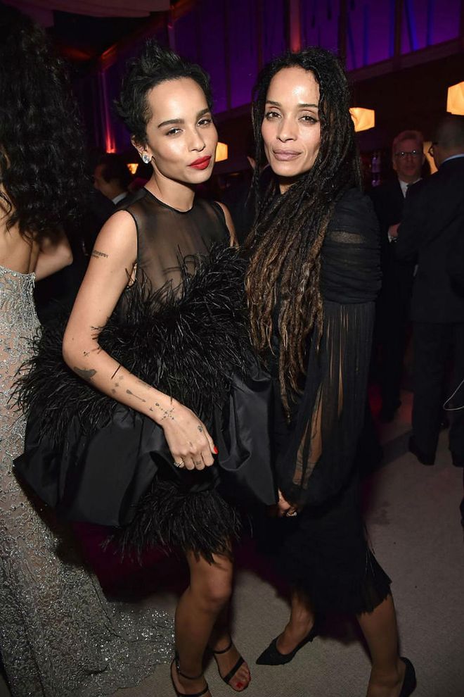Dressing in similar black sheer cocktail dresses, Lisa Bonet and Zoe Kravitz prove that mother-daughter matching doesn't always have to be so literal to get the look across. While Zoe went for a feathered, more youthful take on the LBD, Lisa kept it classic in a sheer draped tulle dress. Photo: Getty