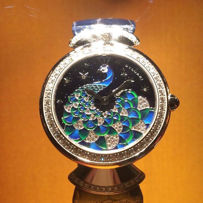 A stunning peacock motif set against a glittering aventurine dial