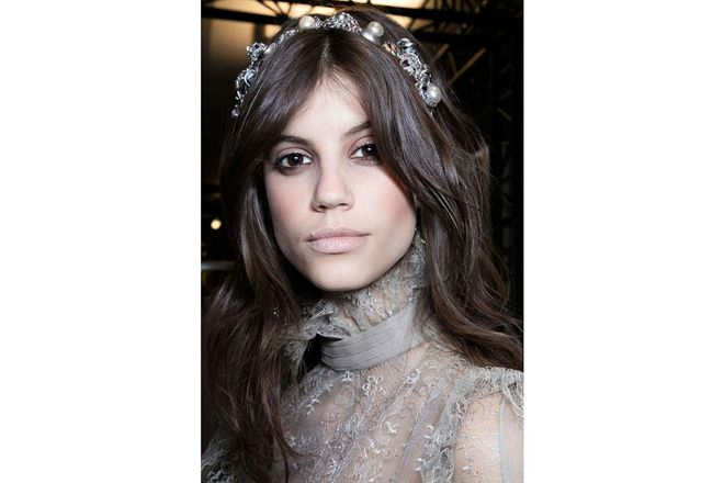 The hair and make-up at Elie Saab was easily the most ethereally beautiful look of the week. While cheeks were lightly bronzed and contoured, the jewelled accessories stole the show as far as the hair was concerned ; Photo: Imaxtree