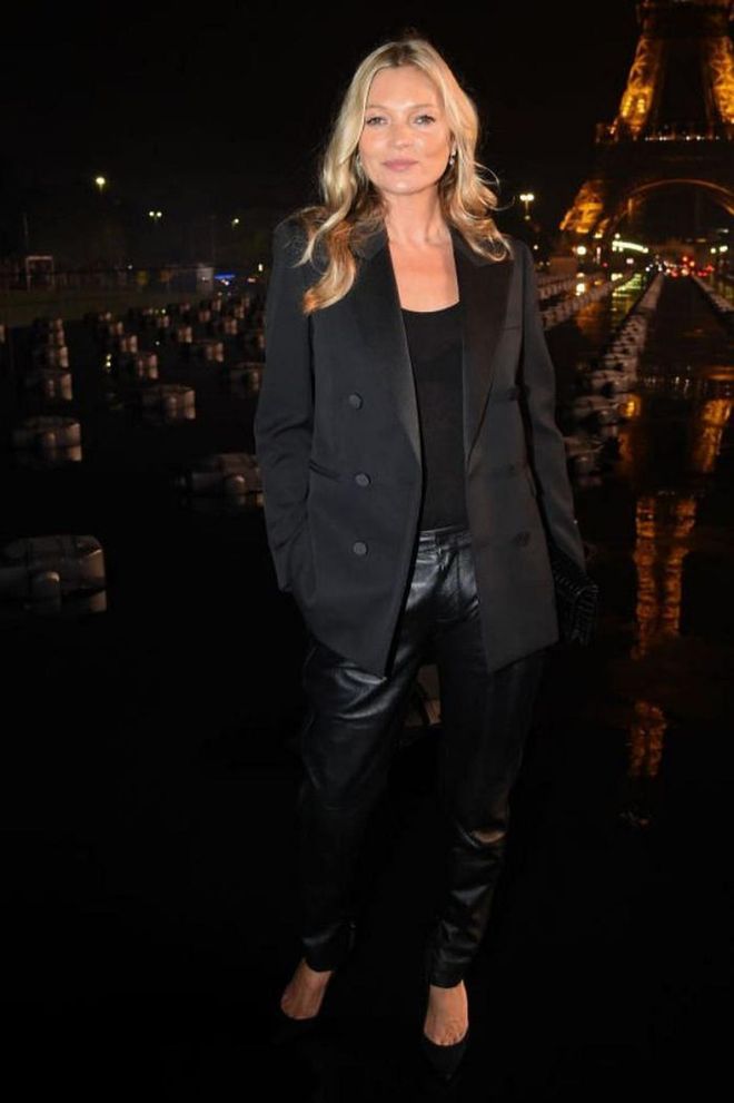 Kate Moss teamed leather trousers with a black blazer for the Saint Laurent show.

Photo: Getty
