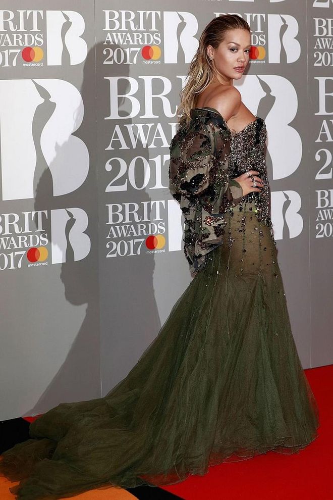 Rita Ora walked the red carpet in an embellished Alexandre Vauthier gown and matching camouflage jacket. Photo: Getty