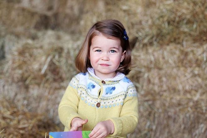 Princess Charlotte smirks in the official portrait for her second birthday in May 2017. This photo, like many others of her and her brother, was shot by the Duchess of Cambridge at their home in Norfolk, England.