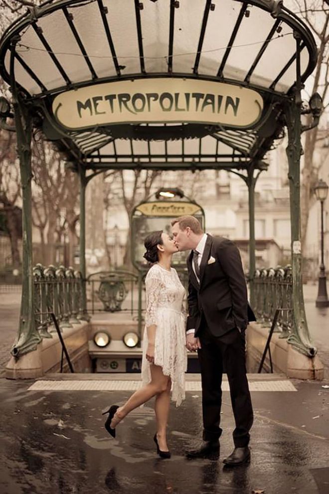 A train station may not seem like the most romantic locale, except when you're getting married in Paris. Even a gloomy day couldn't overshadow this couple, as they stop for a kiss outside the Paris metro.

Via Juliane Berry Photography

