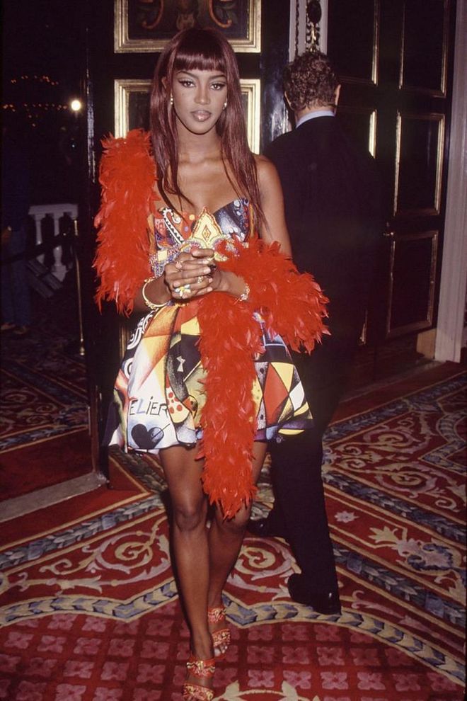 Gracing the music award show with her presence, Naomi Campbell delivered a major '90s fashion moment in a colorful mini dress and red feather boa.