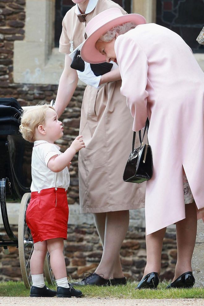 Queen Elizabeth chats with Prince George as they leave Princess Charlotte's christening. Photo: Getty