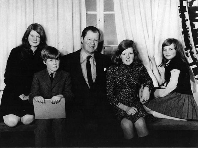 Diana, her siblings, and her father pose for a photograph at home. The family moved to the Spencer estate after Diana's grandfather died, making her father the eighth Earl Spencer.

Photo: Getty