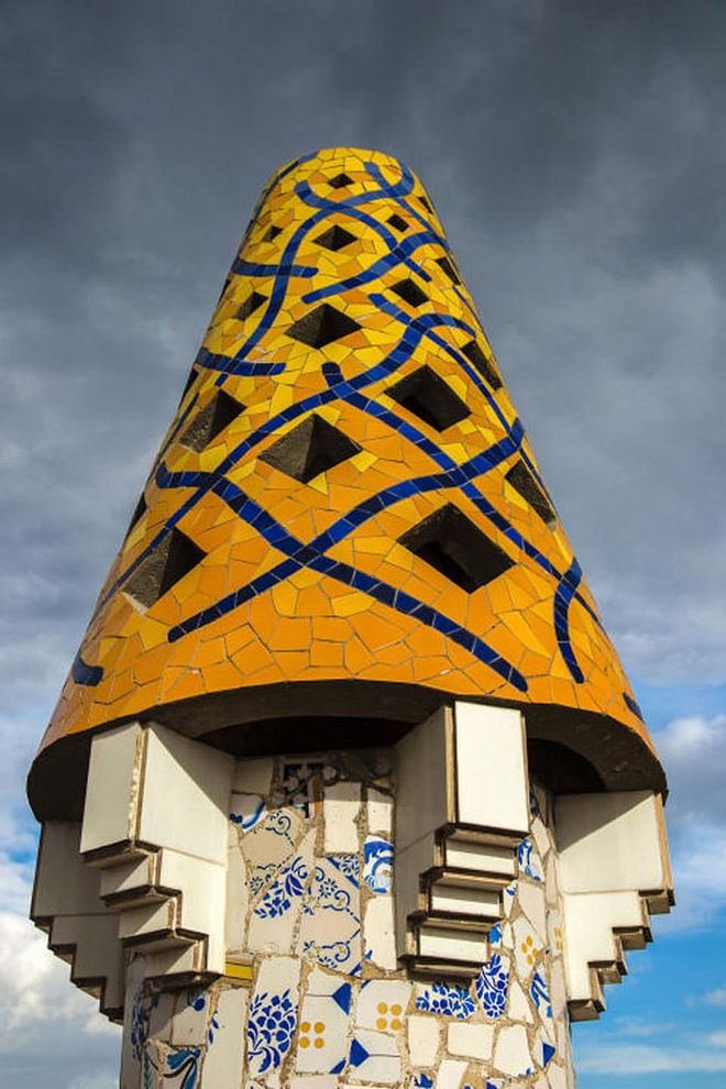 Also commissioned by Eusebi Güell, Gaudí's massive Neo-Gothic mansion off La Rambla was a private home for the Güell family. While the facade is a little tamer than his other designs, the mosaic chimney pots on the roof are classic Gaudí.