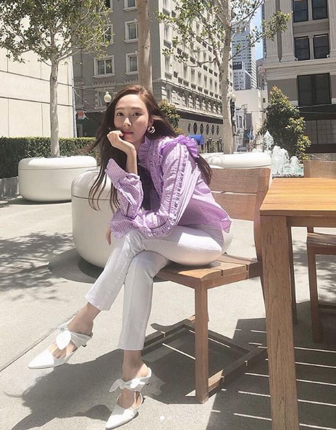 Jung pairs a Blanc and Eclare lilac ruffle blouse with crisp white jeans and matching pointy-toe pumps. It was so good that she had to post it twice! 
Photo: Instagram