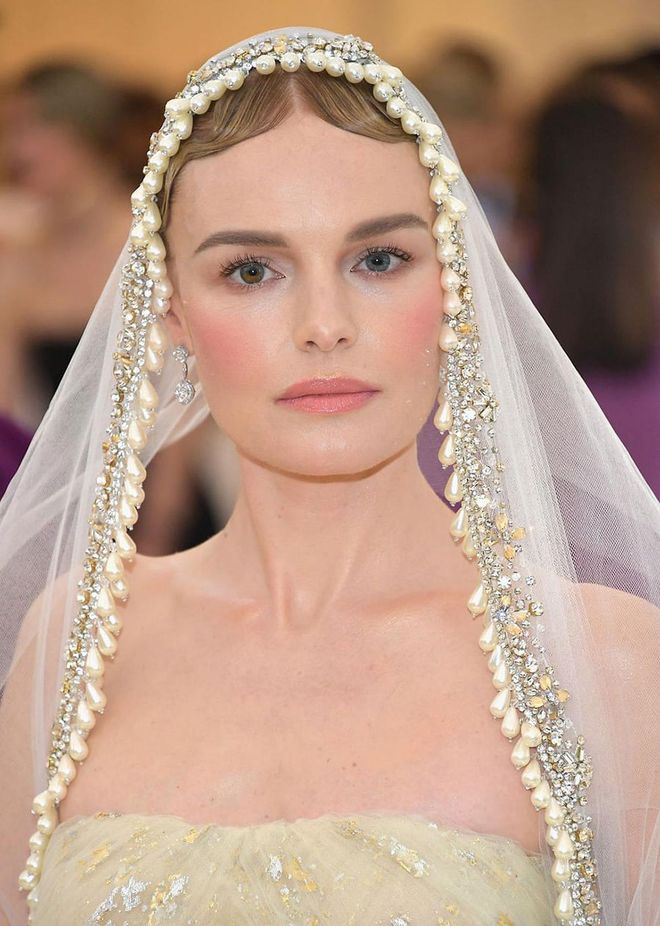 Kaye Bosworth rolled up to this year's Met Gala looking like an actual bride. While her makeup was striking and artful, we do love her intense rosy flush paired with a similar lipstick shade and flutter eyelashes. It's a romantic, soft, and timeless beauty look.
Photo: Getty