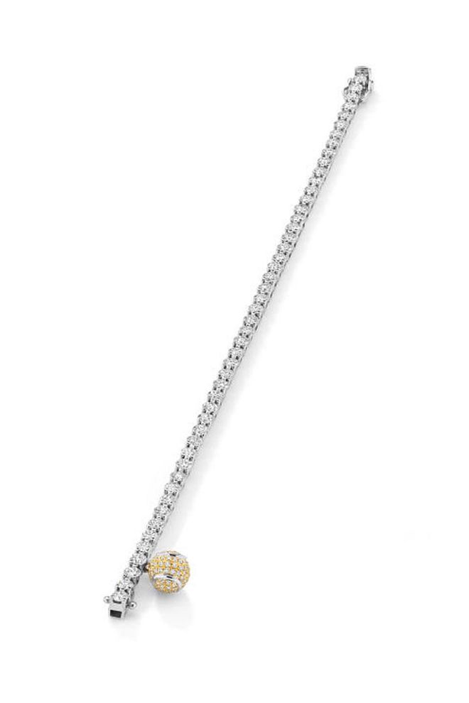 The bracelet with its simple, symmetrical line of diamonds inherited its name as a result of the tennis player Chris Evert, who lost hers during a match at the US Open in 1987 and famously stopped play to find it. The simple design makes it a jewellery staple and we love that Boodles' version has a tiny tennis ball charm to allude to its origins.
Platinum and diamond bracelet with tennis ball charm, from £9,000, Boodles