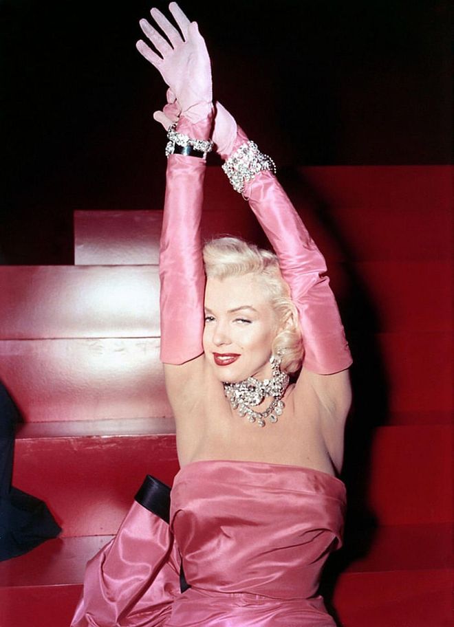 Pretty in pink while singing "Diamonds Are a Girl's Best Friend," in the 1953 film Gentlemen Prefer Blondes. Photo: Getty 