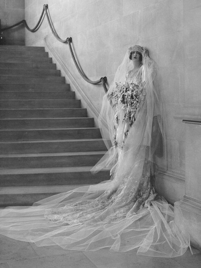 Heiress Cornelia Venderbilt's 1924 wedding to British diplomat John Cecil was the party of the century, and took place at the family's famous Biltmore estate in Asheville. A whopping 2,500 people attended the reception.

“The bride was lovely in a gown of white satin, very straight, with long sleeves,” wrote the Asheville Citizen. “Her bridal veil of tulle and lace, which she wore over her face when entering the church, was four yards long. It was caught with orange blossoms from Florida...Her bridal bouquet was of orchids and lilies of the valley, made in Asheville by the Middlemount Gardens. Each of her satin slippers was ornamented with a single orange blossom.” Photo: Getty 