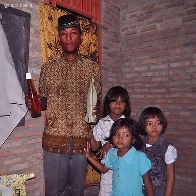 Nothing makes Pharrell, the humble family man happier than spending time with his kids. (Low-key loving the batik shirt)