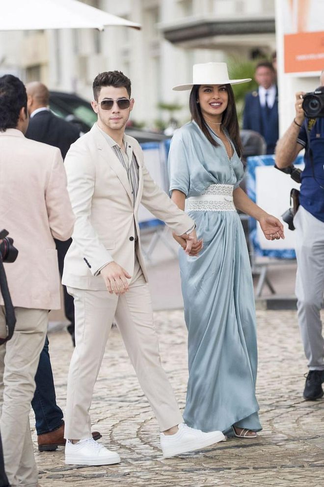 While attending Cannes Film Festival with husband Nick Jonas, Chopra donned a blue Rick Owens dress accessorized with an Alaia belt and white hat.

Photo: Splash News