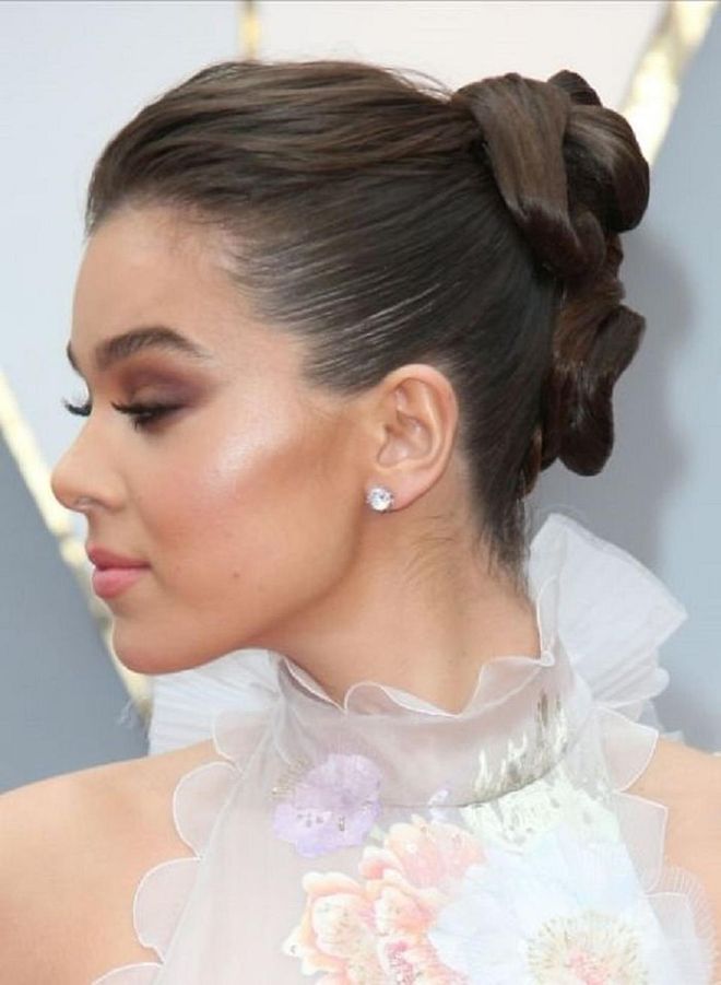 Pageant updos for weddings are a thing of the past. The modern version - seen here on Hailee Steinfeld - has volume on the top and dimension in the back. Photo: Getty 