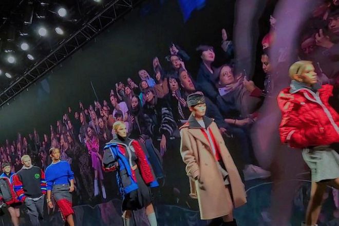 Versace captured live audience on giant LED screen as runway backdrop.