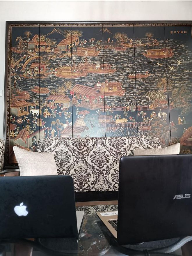 Sometimes when you're having tech difficulties, all you need is a spare laptop, a comfortable sofa and a beautiful piece of chinoiserie behind you to lift your spirits.