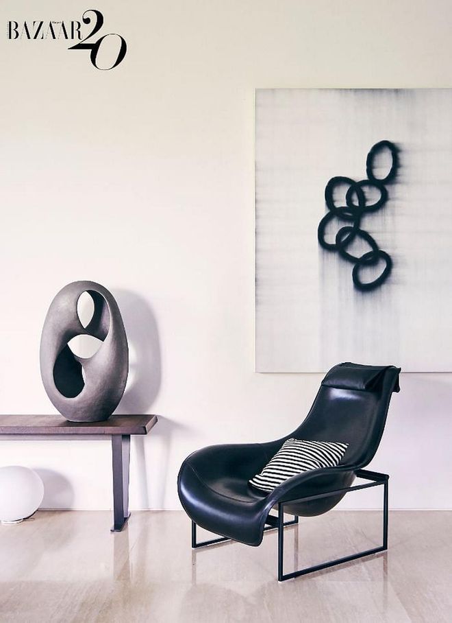 A B&B Italia Mart armchair surrounded by artworks.