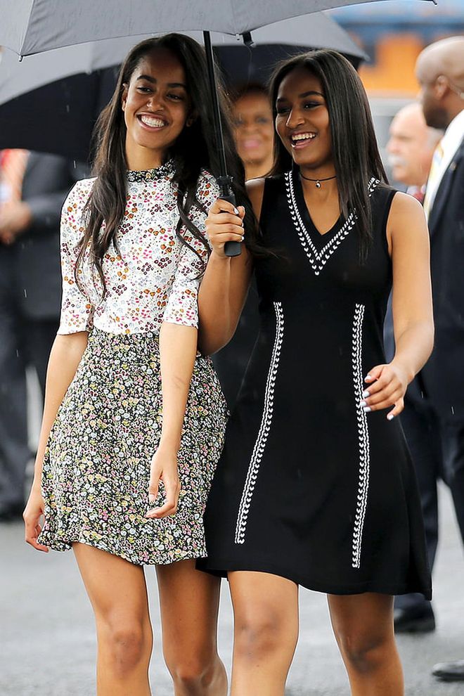 The sister duo looked ready for spring as they arrived in Cuba, Malia choosing a sweet floral frock, while Sasha opted for a black + white sundress by Shoshanna. Photo: Reuters