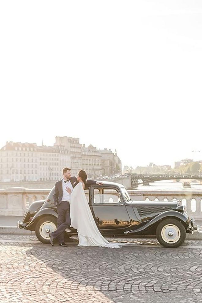 A couple made an entrance at their wedding in this 1952 Citroën Traction, which took them to their reception at the Ritz. Here, they stop for a moment on the Pont Louis-Philippe bridge, overlooking the River Seine.

Via Claire Morris Photography

