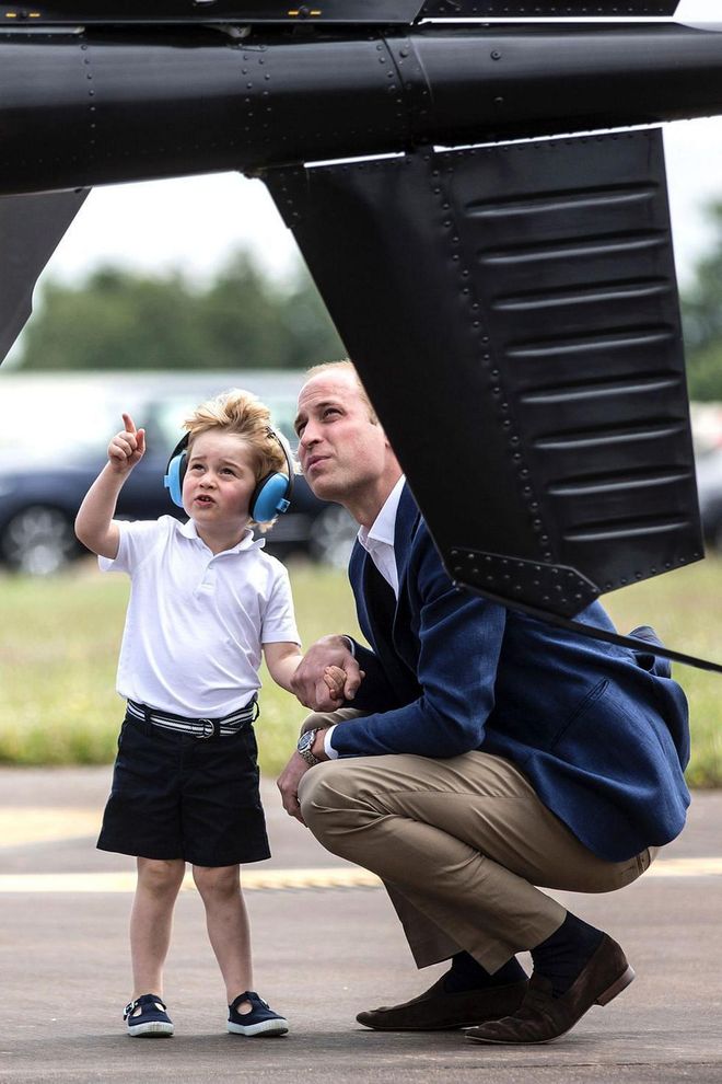 Prince George points as he and his father Prince William look at a 'Squirrel' helicopter during a visit to the Royal International Air Tattoo at RAF Fairford.

Photo: Getty