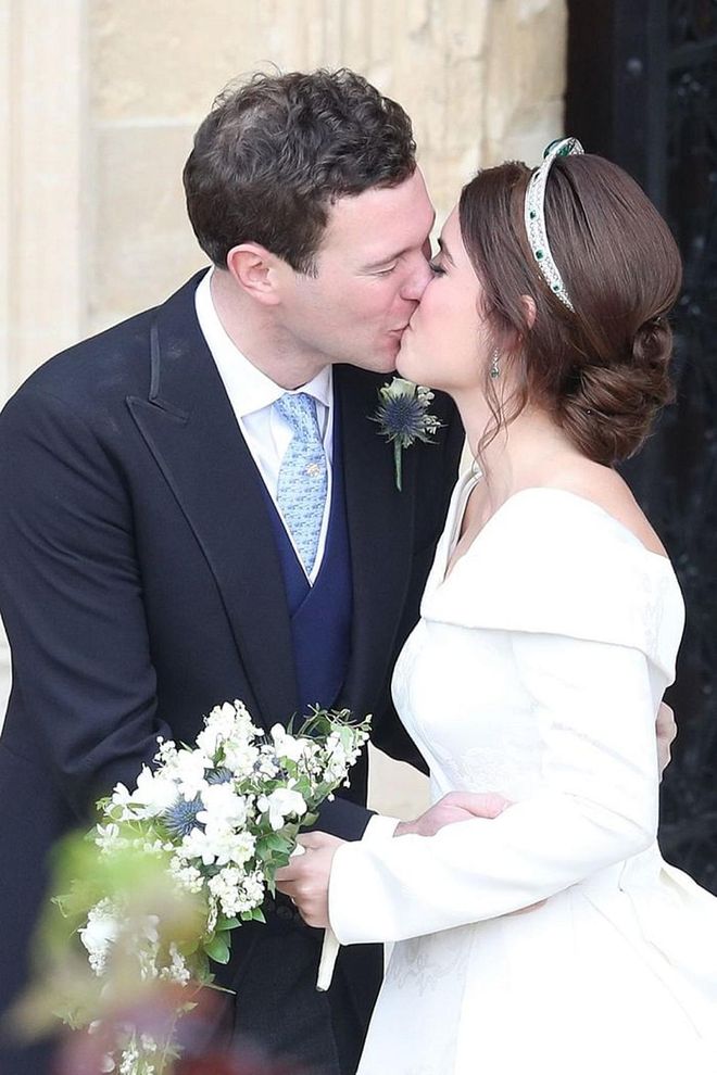 Princess Eugenie and Jack Brooksbank share a kiss outside of the chapel.