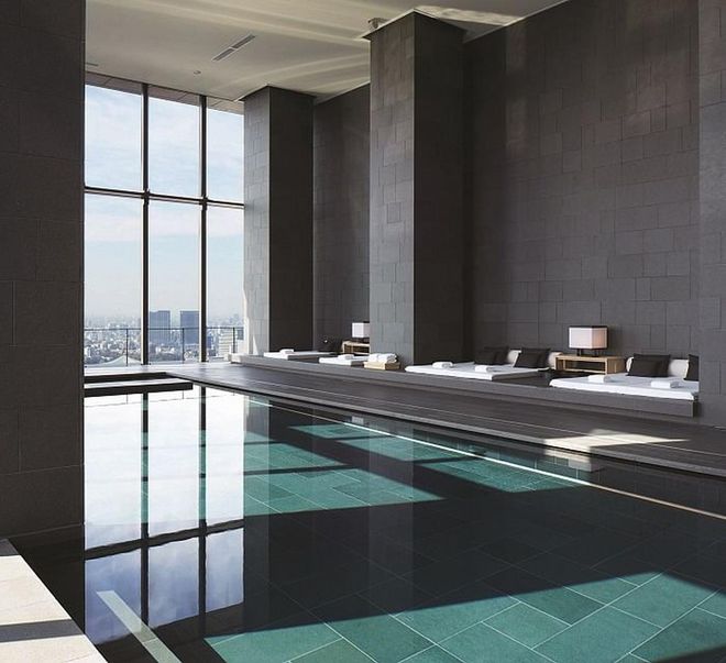 The Aman Spa swimming pool is light-filled and offers unforgettable panoramic views of the city