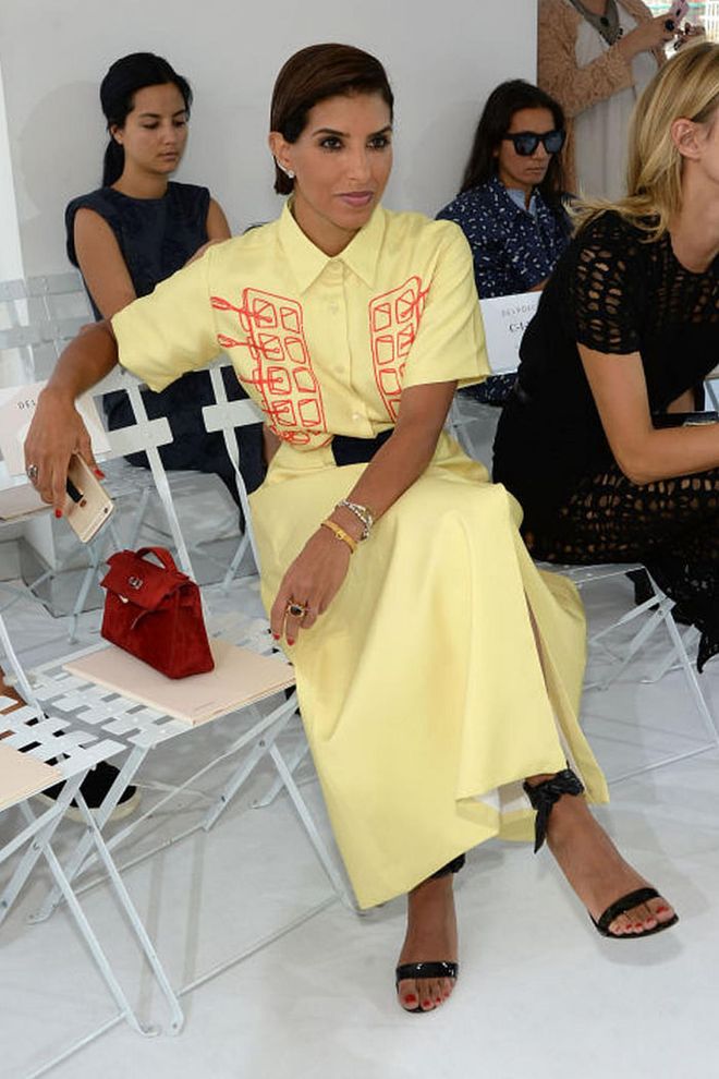 She's a favorite of street style photographers for her daring looks. Here, she is pictured ere at the Delpozo Spring 2016 show in a striking yellow shirtdress.