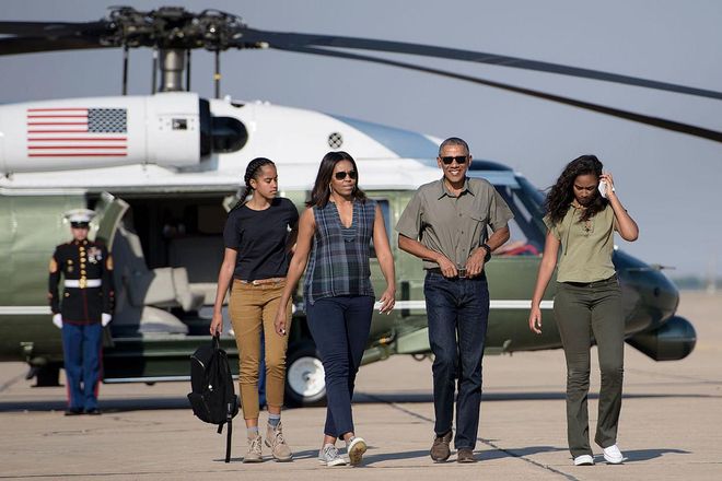The Obamas take on a casual outing in New Mexico in neutral, army hues. Malia reprised her braided look over a t-shirt and khakis while Sasha went for monochrome cargo green. Photo: Getty
