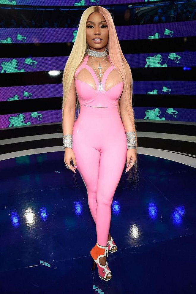 Flaunting her famous curves, the rapper rocked a bubblegum pink latex bodysuit by Vex Latex.