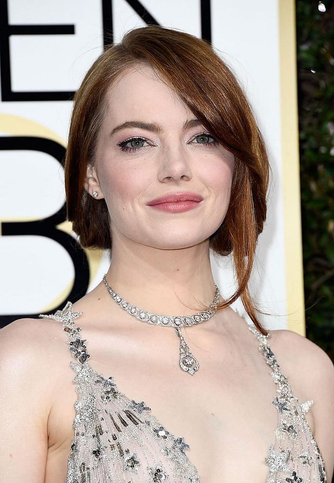 Emma Stone kept things natural and pretty with a wash of shimmery eye shadow and pink-nude lipstick.

Photo: Getty Images