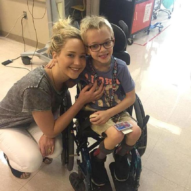 Taking a break from filming X-Men: Apocalypse in Montreal, Jennifer Lawrence proved she is a superhero both onscreen and off. Posing for photos with patients and staff at Shriners Hospital for Children, the actress did not fail to cause *major* feels all around.
"A very special visitor stopped by our Canada hospital today," Shriners wrote on their official Facebook page. "Jennifer Lawrence is in Montreal filming a new movie and she made time to visit some of our #ShrinersCanada kids and staff. Everyone had a great time!"
J-Law, always doing the most. Photo: Shriners Hospital for Children