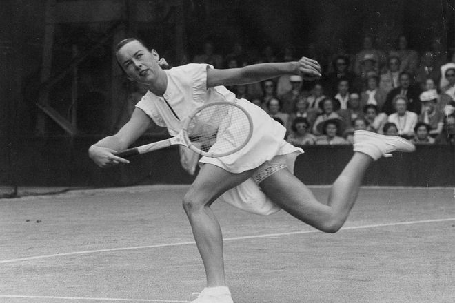 Post war, many tennis stars on Wimbledon were taken in under the wing of the very talented Ted Tinling—the multi-hyphenate fashion designer dressed tennis stars up until the ’80s. Under his style tutelage, American tennis player Gertrude Moran took to the courts in satin-trimmed frilly white dresses. Her famous lace knickers will be remembered in tennis circles for years to come—probably a prelude to the now-popular innerwear as outerwear trend? Perhaps not, but might as well be. Photo: Getty