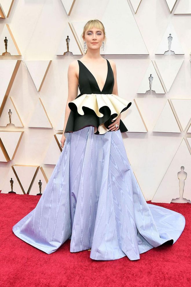 What: Custom Gucci

Why: Ronan stood out in a sea of black in this black, ivory, and lavender gown with deep V-neck, silk duchesse-waist ruffles and moiré skirt, finished with Gucci High Jewelry earrings and ring. It's elegant, but risk-taking—the ideal combination for a nominee. Photo: Getty