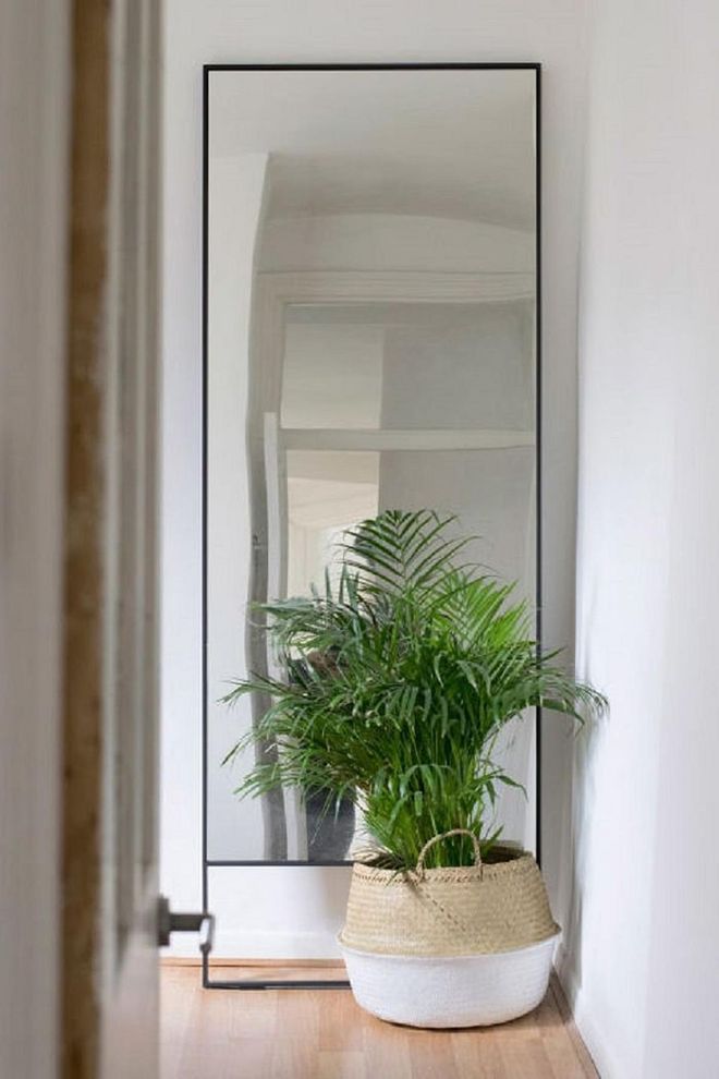 If you're lacking in space, mirrors are the perfect addition to any room. Not only can they be placed on the wall, meaning you avoid taking up precious floor space, they also reflect light to make a space appear bigger. The best place to position a mirror is opposite a window to reflect the most light possible. Photo: TOPOLOGY LONDON