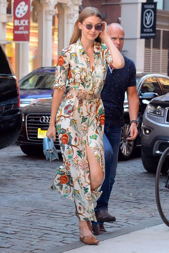 Looking more summery than ever in a floral Alberta Ferretti dress and a small pale blue bag from Paula Cademartori. 