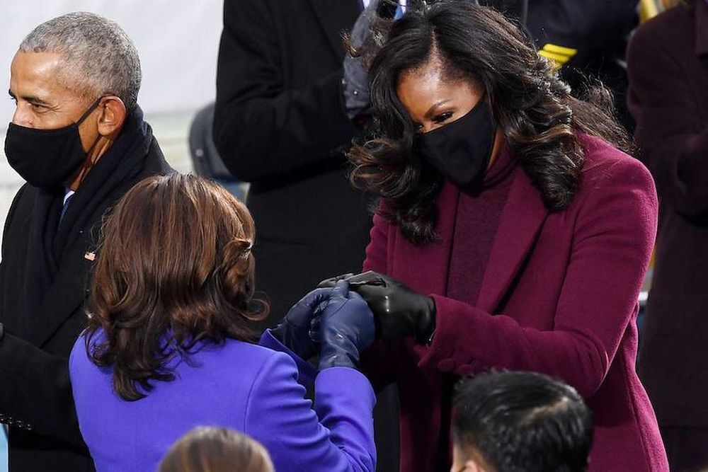 Vice President-elect Kamala Harris (L) is greeted by former first lady Michelle Obama (R) during the 59th Presidential Inauguration. (Photo: Olivier Douliery/Getty Images) 
