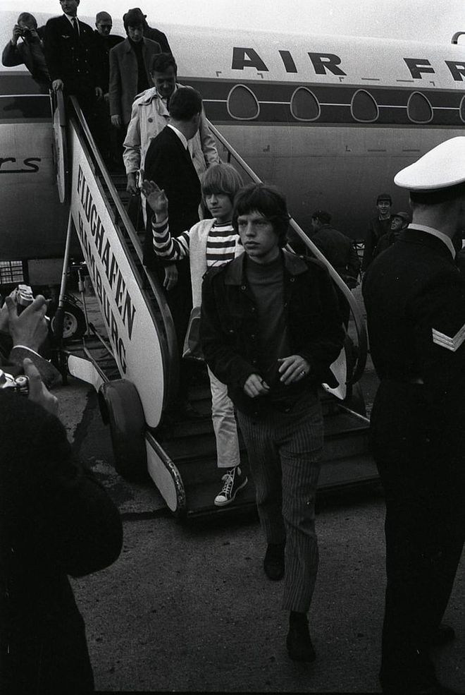 The Stones exit their plane in Hamburg, Germany, in 1965. 

Photo: Getty 