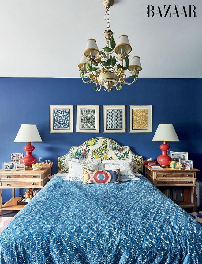 An antique lemon lamp hangs over the bed in their cosy master bedroom.