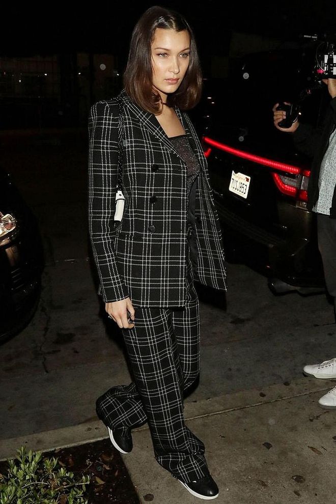 In a plaid Dior suit. Photo: Getty 