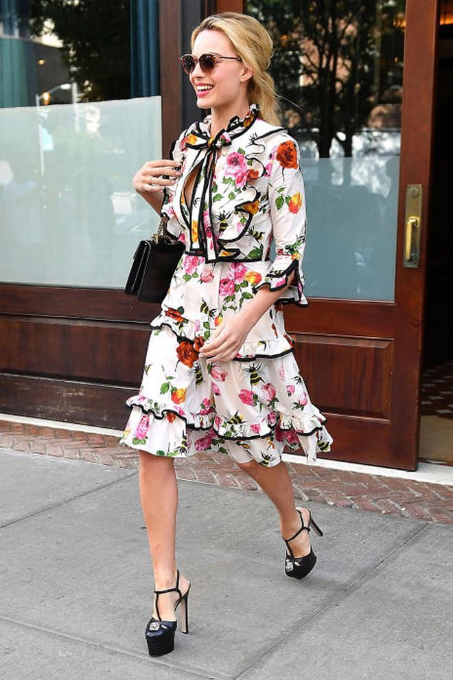 Margot Robbie in a floral Gucci dress while out for press in New York. Photo: Splash
