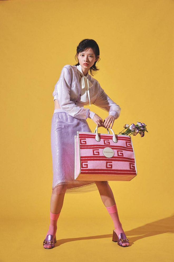 Cropped cardigan, from Miu Miu. Blouse and skirt, both from Prada. Bag, and mules, both from Gucci. Socks, stylist’s own (Photo: Vee Chin)