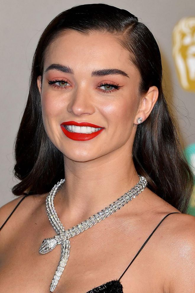 Update your red lip by matching it to your eye make-up, as Amy Jackson demonstrates. Try partnering the NARS Single Eyeshadow in Melrose with Lancôme L'Absolu Rouge Drama Matte Lipstick in Obsessive Red. Photo: Getty