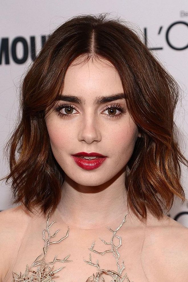 Lily Collins’ middle-parted beach waves suit every length, from bob to lob. 