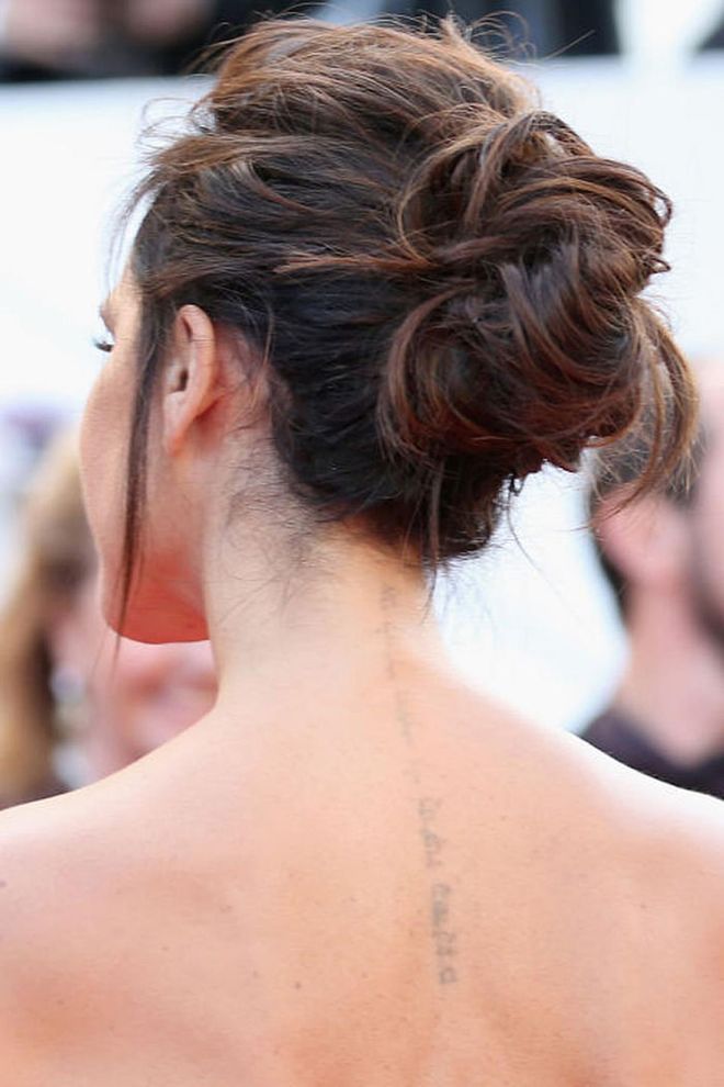 This deconstructed French Twist-meets-messy bun is equal parts edgy and elegant. Pro tip: backcomb your entire head before pinning sections in the back center of your head. Photo: Getty
